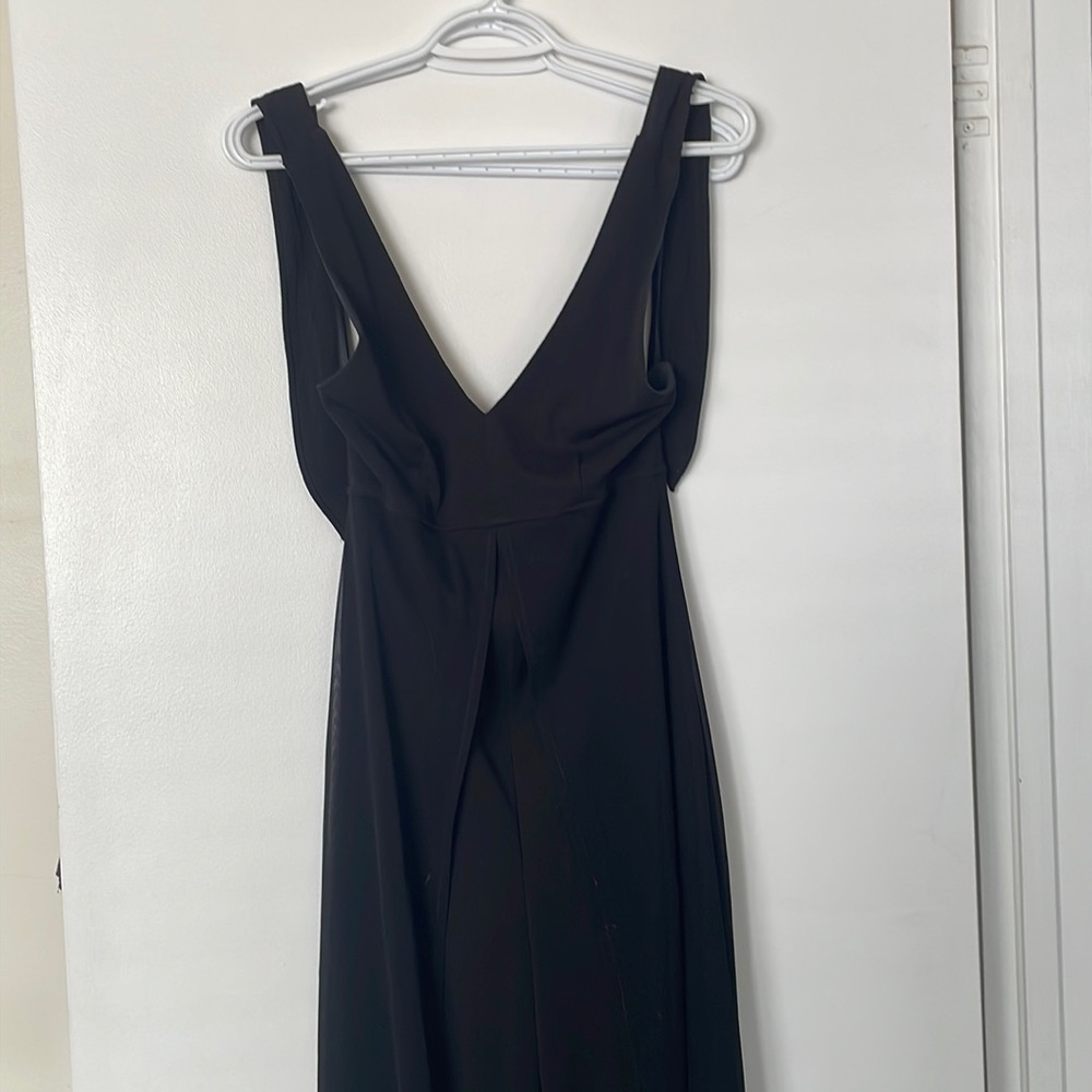 Black, sexy, classy, one piece with sheer cape starting at the waist.